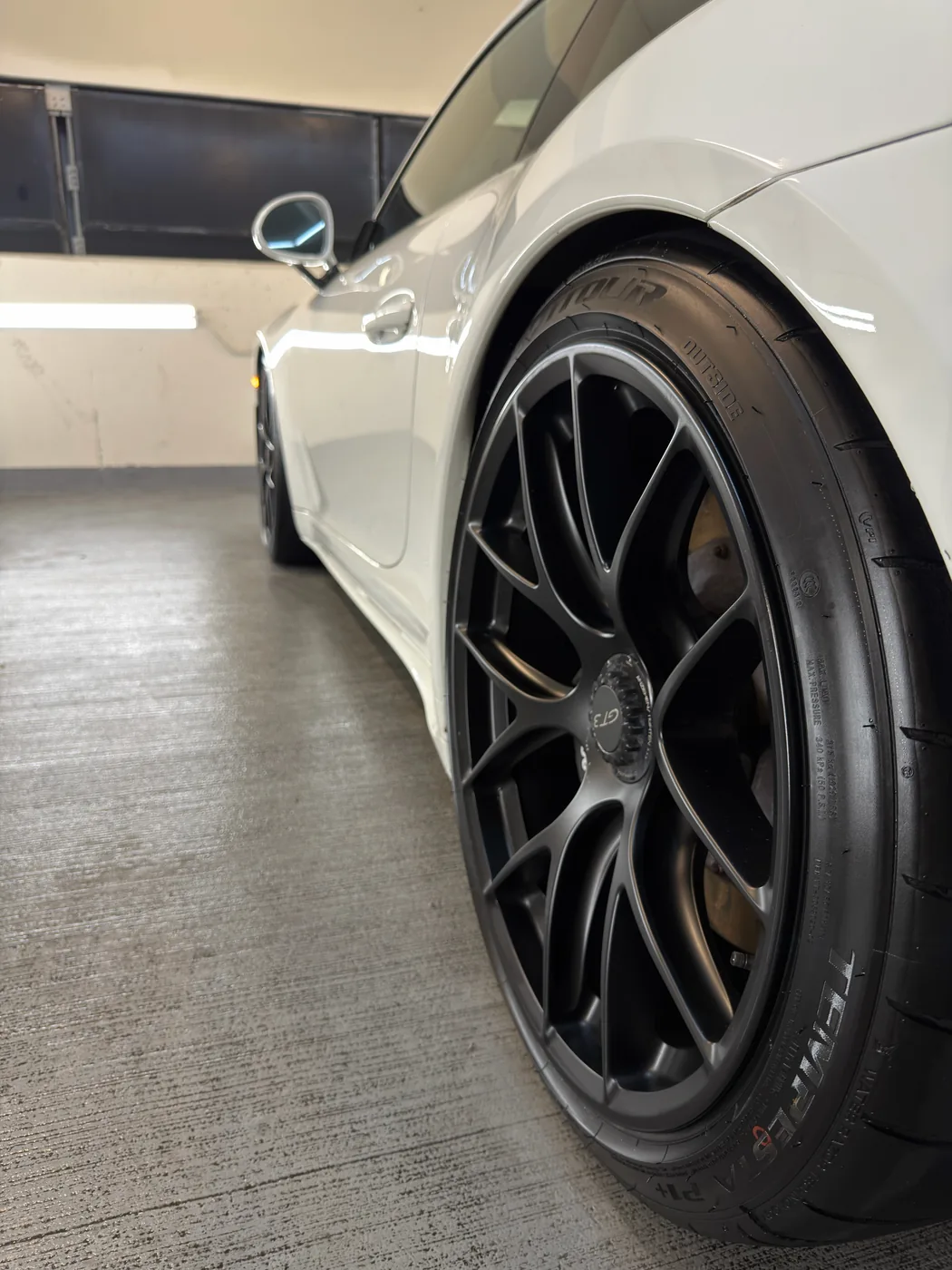 Porsche GT3 wheel after detailing — spotless, glossy finish