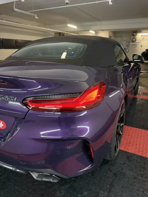BMW M4 rear after detailing — glossy, swirl-free paint