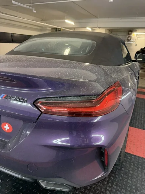 BMW M4 rear before detailing — dusty, dull paint