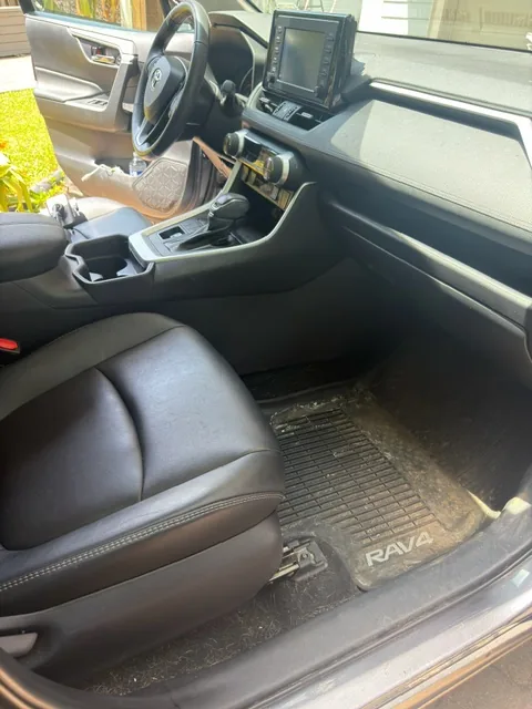 Toyota RAV4 interior before detailing — dusty seats and floor mats