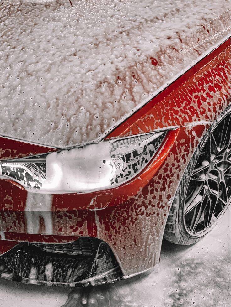 Foam-covered car mid-wash at Apollo Auto Detailing