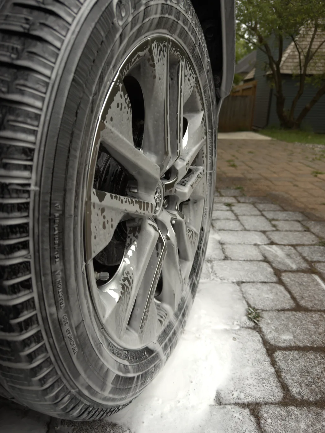 Toyota wheel covered in foam during wash