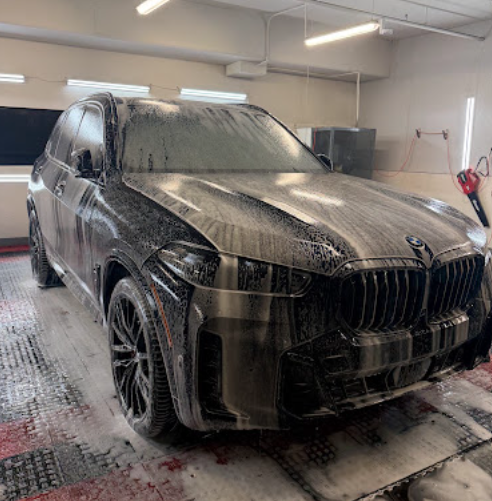 BMW X5 covered in foam during wash